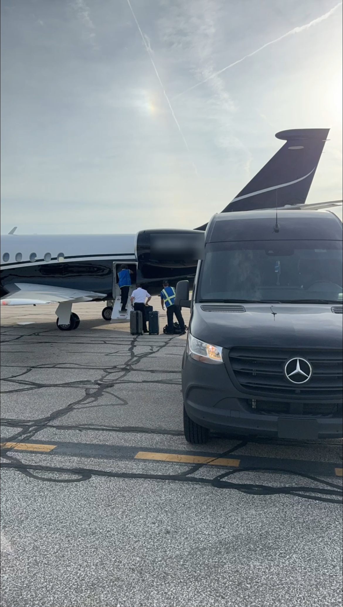 Two black SUVs back to back at night